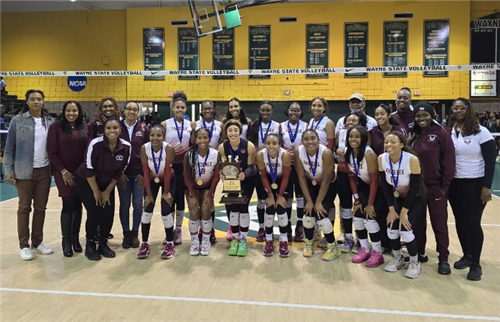  RHS girls volleyball team posing with trophy